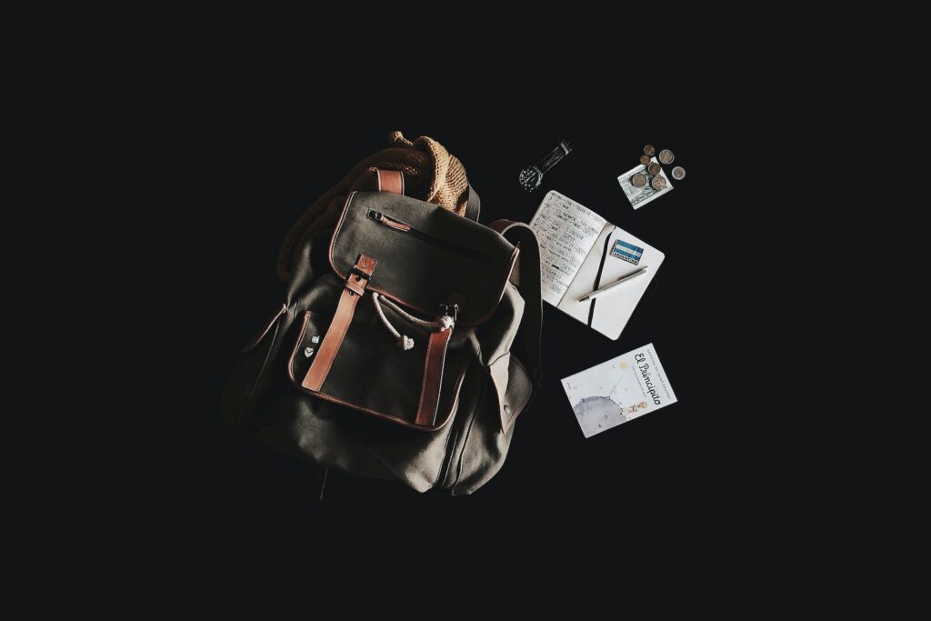 black and brown backpack with black nackground